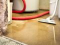 vacuum cleaning up water for prompt water damage restoration