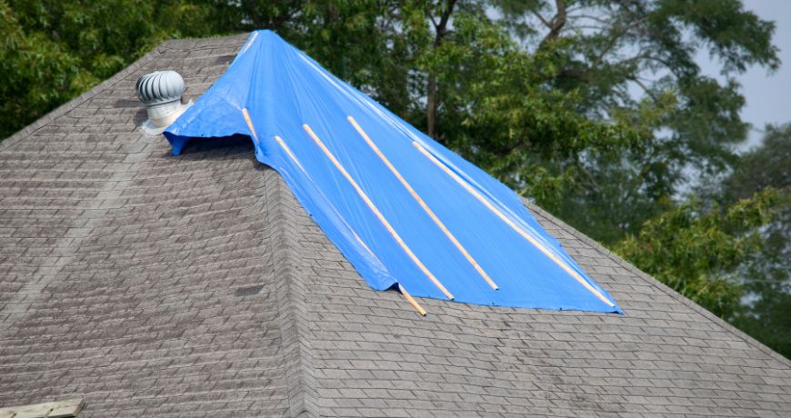 tarp on roof for storm damage repair in charlotte nc