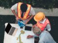 construction workers discussing commercial renovation timeline