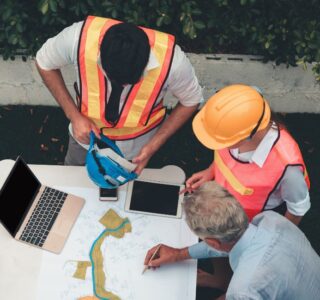 construction workers discussing commercial renovation timeline