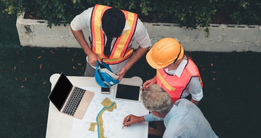 construction workers discussing commercial renovation timeline